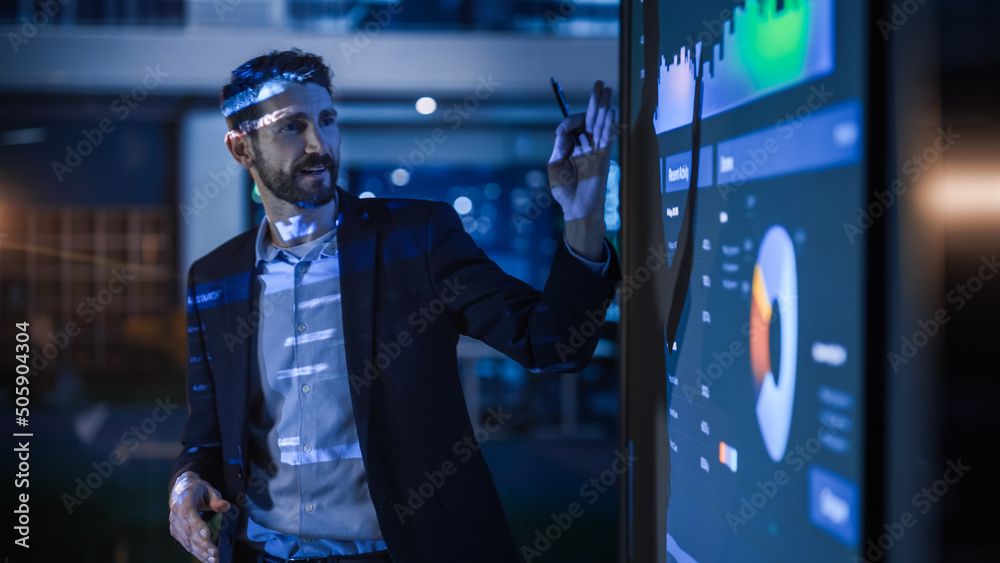 Business leader presenting marketing performance data on a large digital display